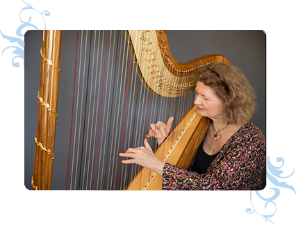 Dominique playing her harp